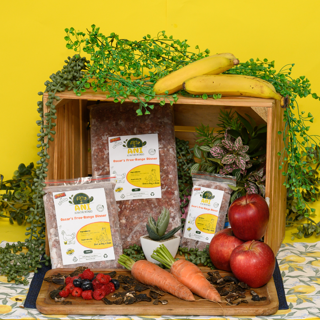 Packaging of Oscar's Pure Free Range Chicken Mince displayed with assorted fruits and vegetables in the background, suggesting natural ingredients.