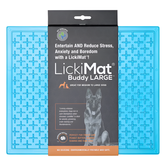 A LickiMat Buddy X Large in blue color, displayed next to its packaging that has an image of a dog and text describing the product's benefits for stress reduction and slower feeding.