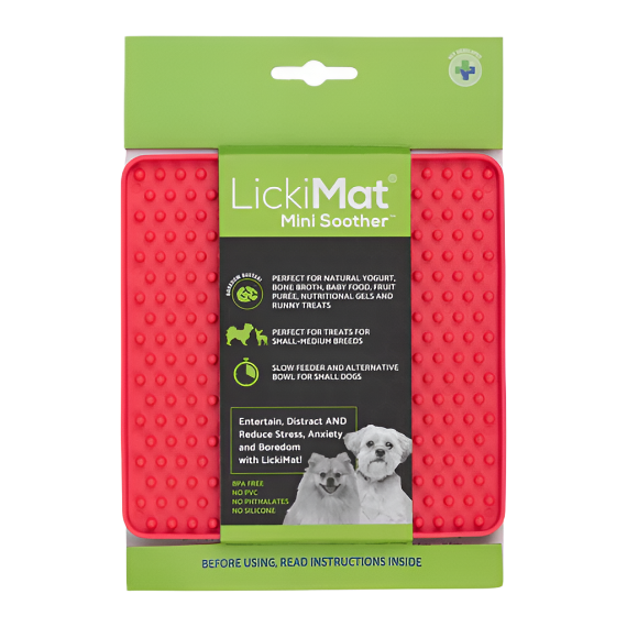 A packaged LickiMat Mini Soother for pets, featuring the product in a bright red color with before and after usage images, and text highlighting its benefits for stress reduction and oral health.