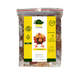A bag of dog food branded 'Turkey Dinner' from As Nature Intended, surrounded by images of raw turkey meat, vegetables, and fruit on a wooden table against a yellow background with green leaves.